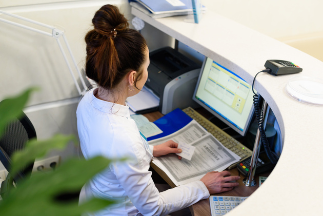 Female receptionist working at a hospital. 
